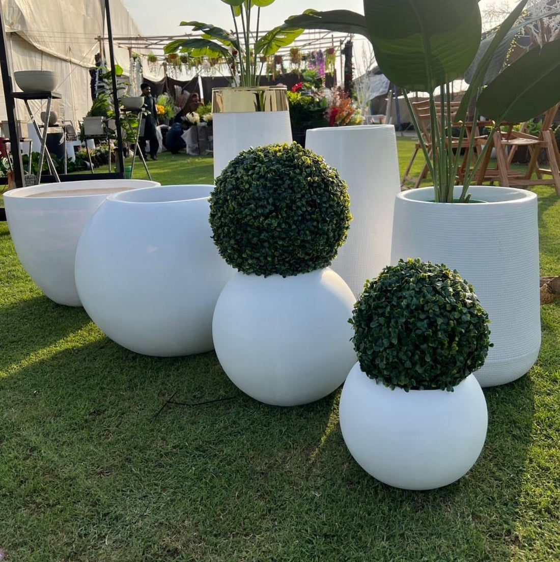 beautiful faux plant with white rounded pot 